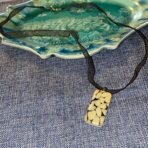 Handmade Necklace Made With A Domino Strung on Ribbon Silver Colored Hardware